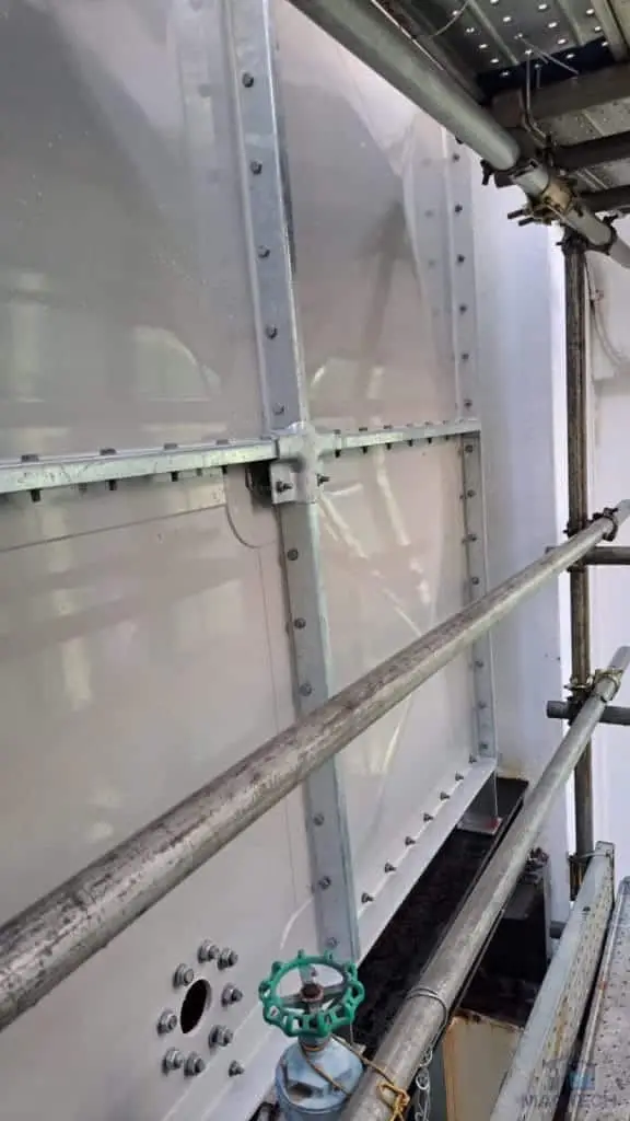 FRP/GRP domestic water tank replacement at One Finlayson Green, Singapore – completed exterior panels within the narrow access area