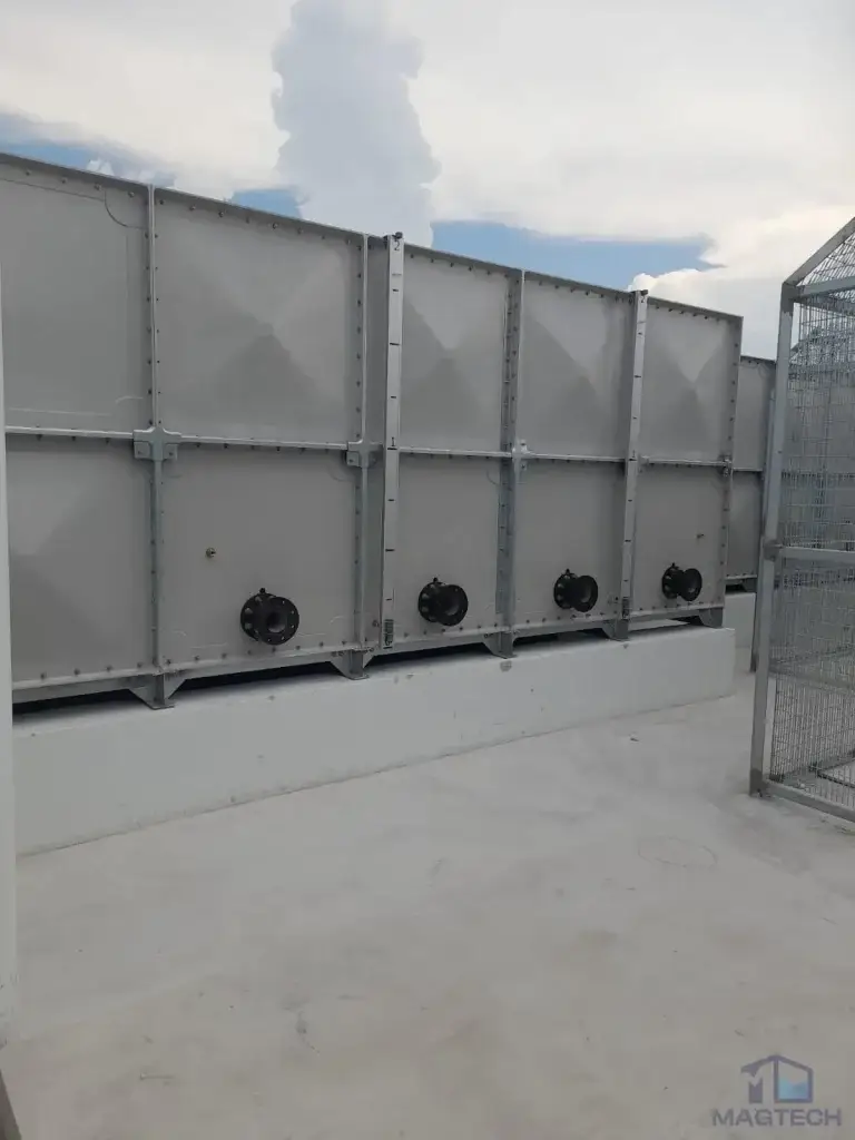 FRP water tank installation at Jalan Tembusu, Singapore – completed tank panels with multiple outlet connections