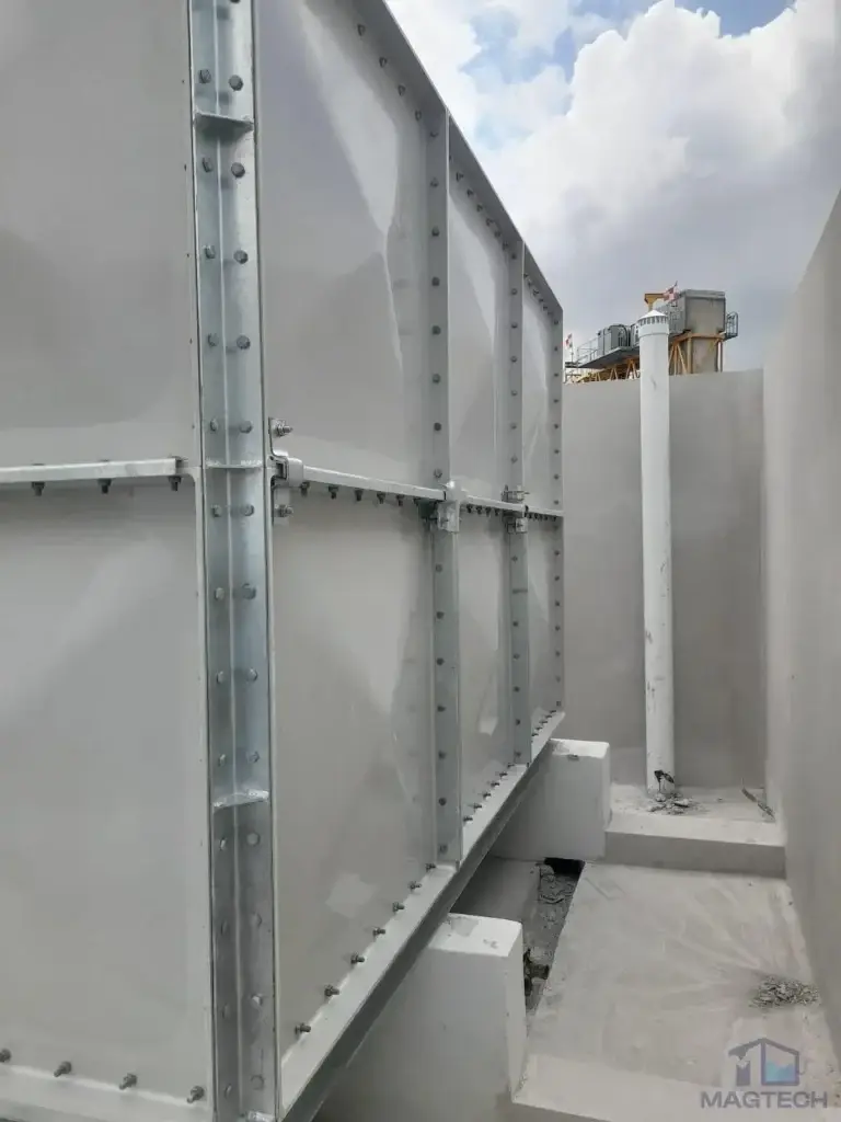 FRP water tank installation at Jalan Tembusu, Singapore – narrow walkway beside the completed sectional tank