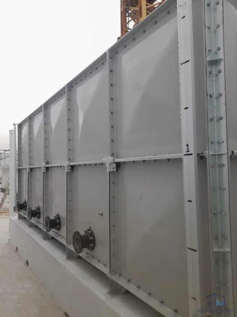 FRP water tank installation at Jalan Tembusu, Singapore – long side view of the sectional tank and outlet connections