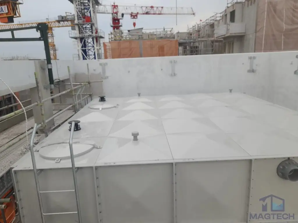 FRP water tank installation at Jalan Tembusu, Singapore – top view of the tank roof panels, access hatch and safety guardrails
