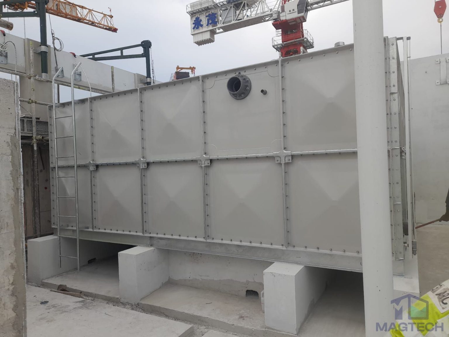 FRP water tank installation at Jalan Tembusu, Singapore – front view of the elevated tank with access ladder