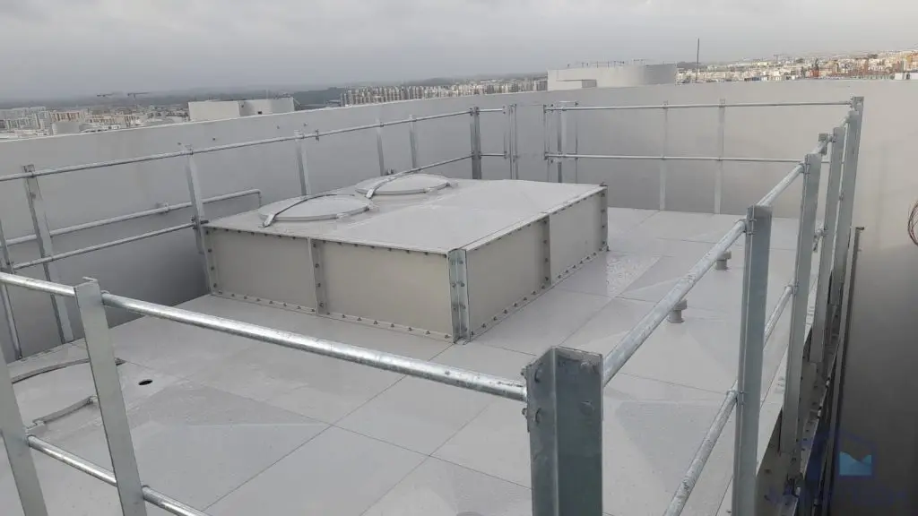 FRP water tank replacement at Parc Oasis Condominium, Singapore – completed domestic water tanks with roof panels and safety guardrails