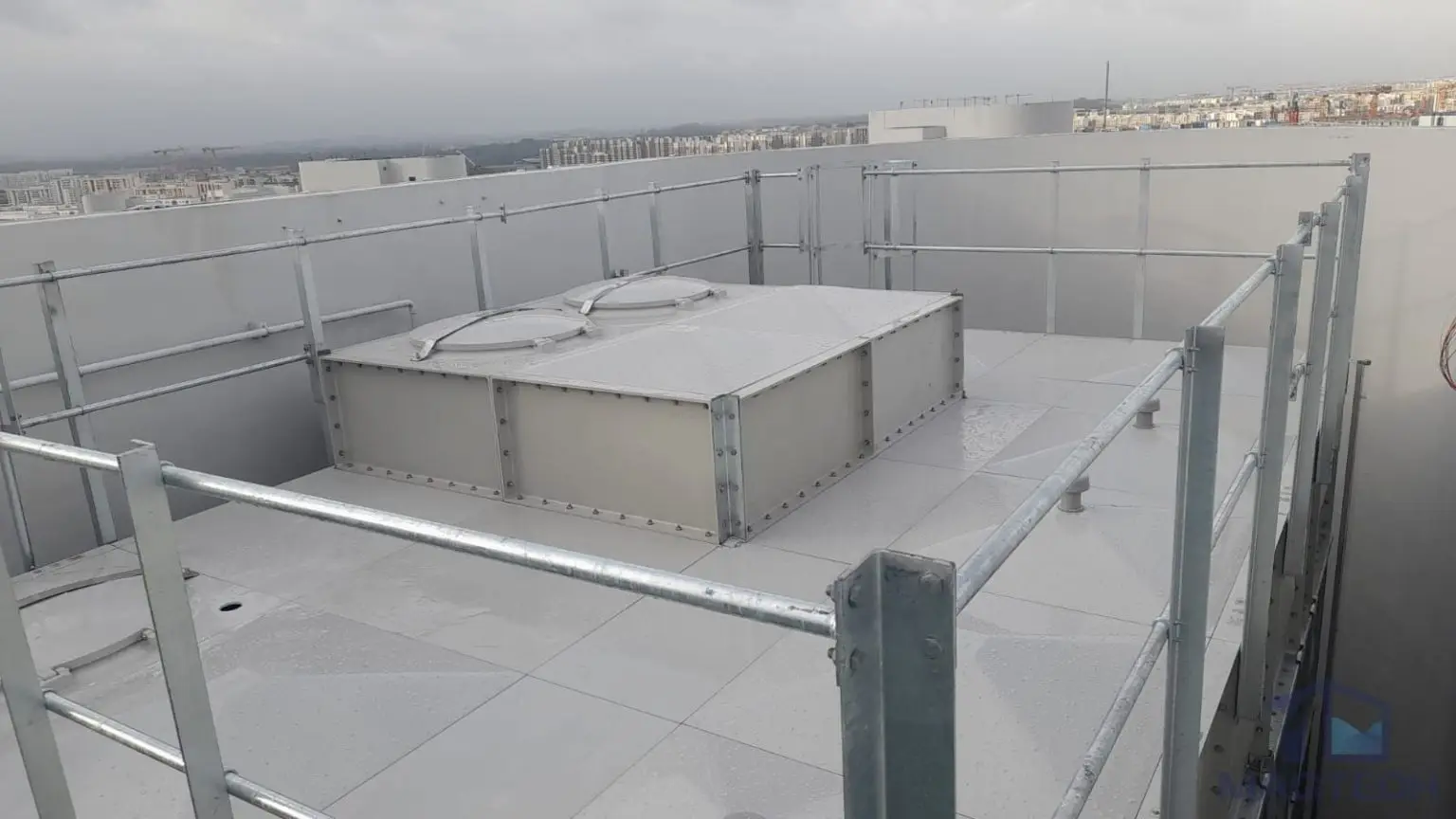 FRP water tank replacement at Parc Oasis Condominium, Singapore – completed domestic water tanks with roof panels and safety guardrails
