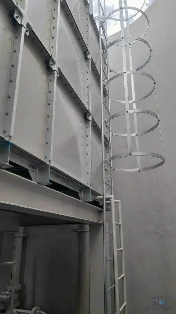 FRP water tank replacement at Parc Oasis Condominium, Singapore – access ladder installed between the sectional tanks