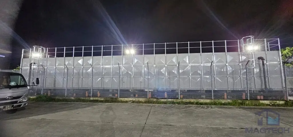FRP water tank installation at Jurong Island, Singapore – completed sectional tank photographed at night