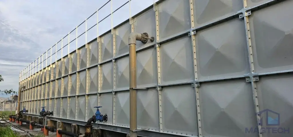FRP water tank installation at Jurong Island, Singapore – completed sectional tank with external pipe connections