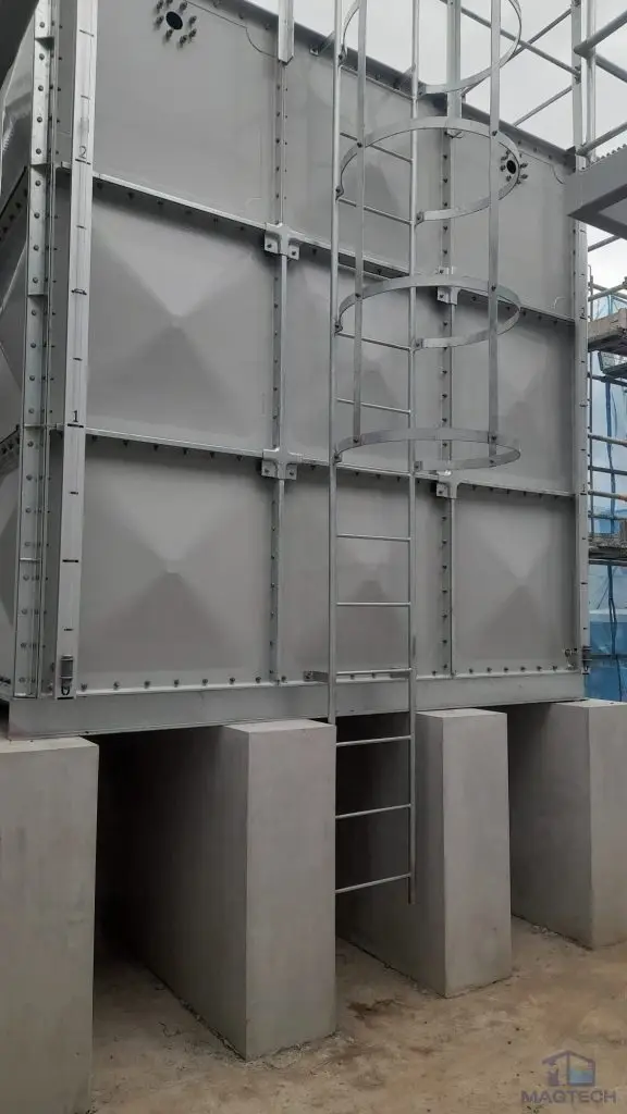 FRP water tank installation at Tengah HDB, Singapore – completed sectional tank supported on concrete plinths