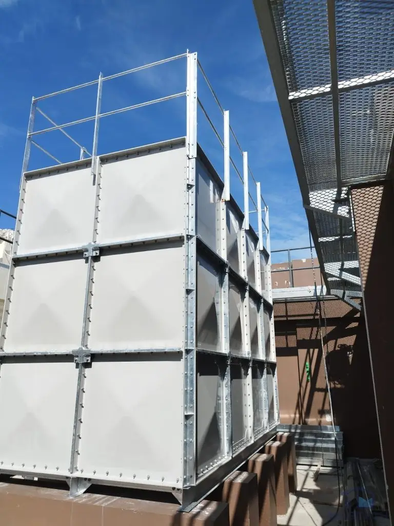 FRP water tank installation at Tengah HDB, Singapore – completed sectional tank with roof guardrails