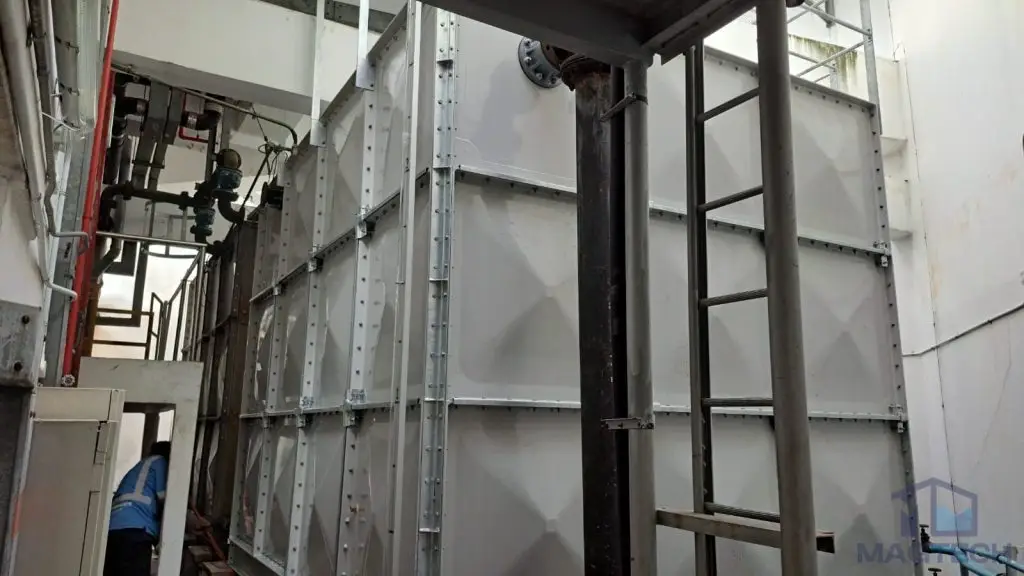 FRP/GRP domestic water tank replacement at One Finlayson Green, Singapore – completed sectional tank beside plant room pipework