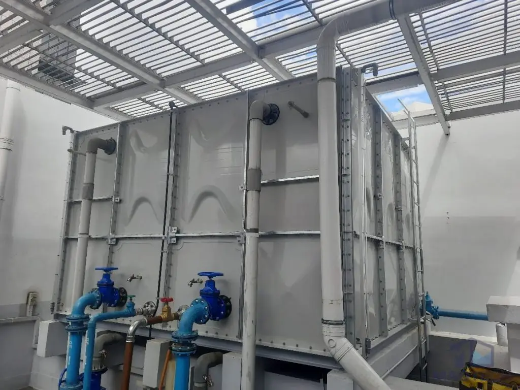 FRP/GRP domestic water tank replacement at Kim Tian Hotel, Singapore – close view of the completed tank panels and pipe connections