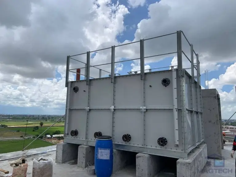 FRP/GRP water tank installation at Centre for Banking Studies, Cambodia – completed sectional tank with roof safety guardrails