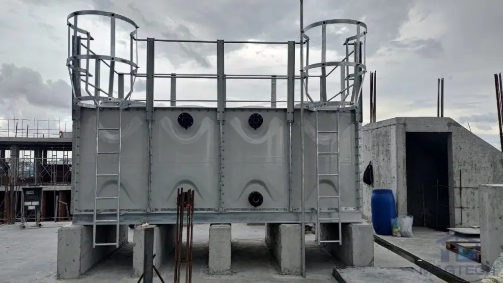 FRP/GRP water tank installation at Centre for Banking Studies, Cambodia – front view of the completed tank with access ladders and pipe connections