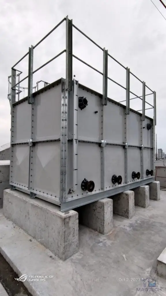 FRP/GRP water tank installation at Centre for Banking Studies, Cambodia – side view of the completed tank on concrete supports