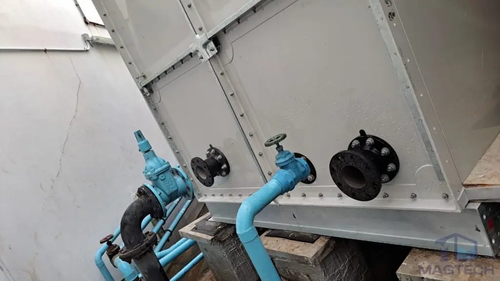 FRP/GRP water tank replacement at AIA Tower, Singapore – Flanged outlet and drain nozzles on the lower panels of an FRP water tank