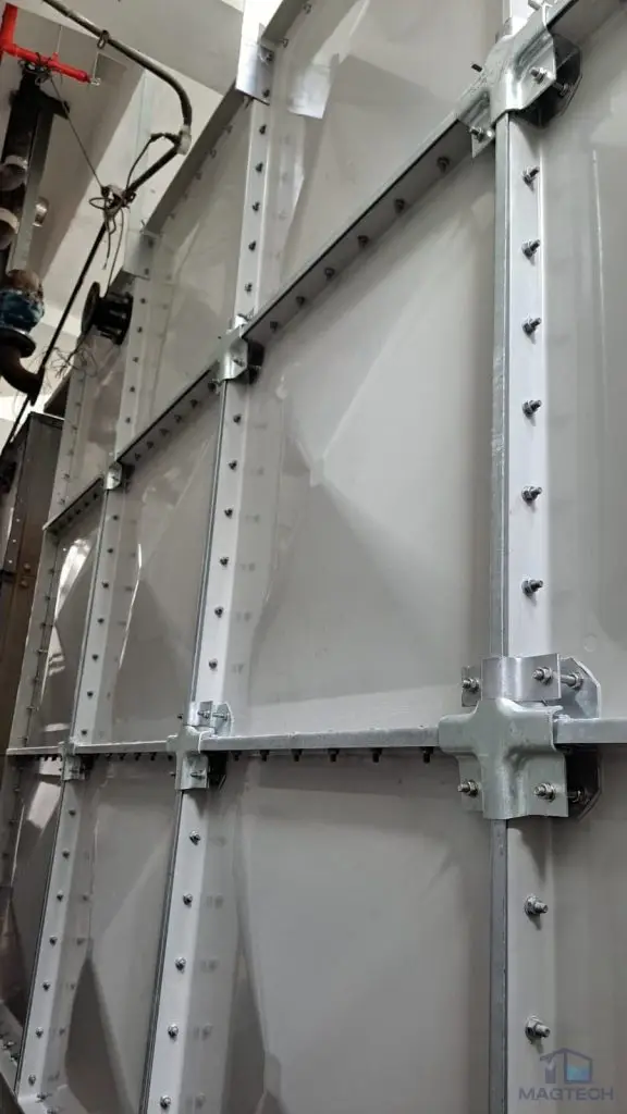 FRP/GRP water tank replacement at AIA Tower, Singapore – completed tank exterior with steel supports