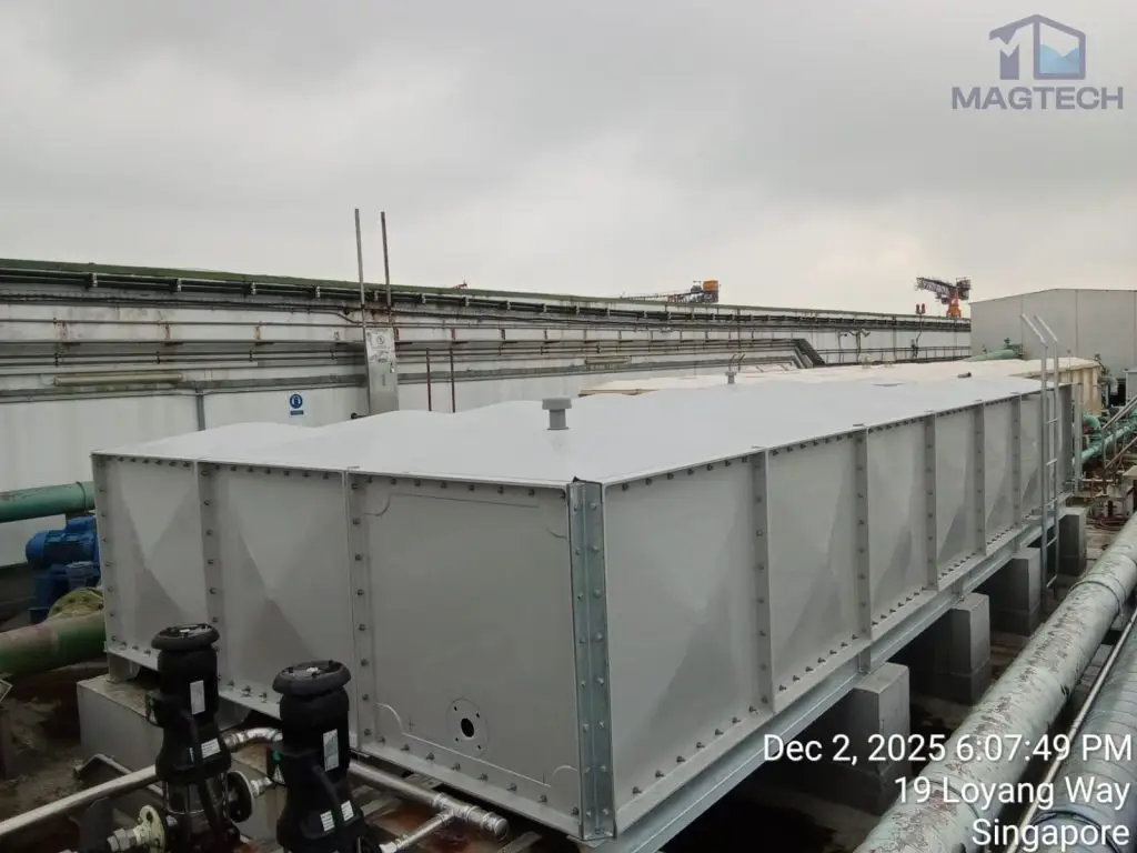 Water tank replacement at Changi Logistics Centre, Singapore – completed FRP sectional tank connected to pump pipework