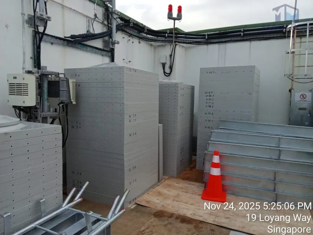 Water tank replacement at Changi Logistics Centre, Singapore – sectional tank panels stored on site before assembly