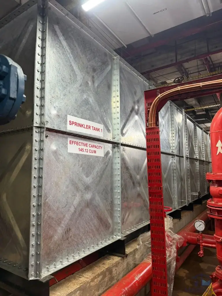 HDG water tank replacement at Changi Terminal 1, Singapore – completed pressed steel tank beside fire protection pipework