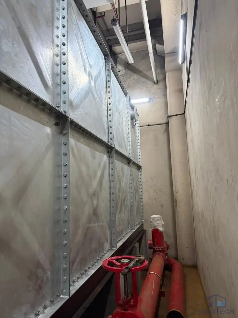 HDG water tank replacement at Changi Terminal 1, Singapore – completed tank installation with connected red pipework