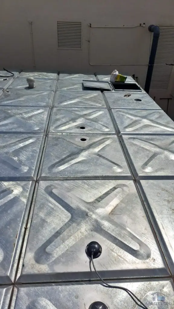 HDG pressed steel water tank replacement at Heritage Apartment, Singapore –during work galvanized tank roof panels