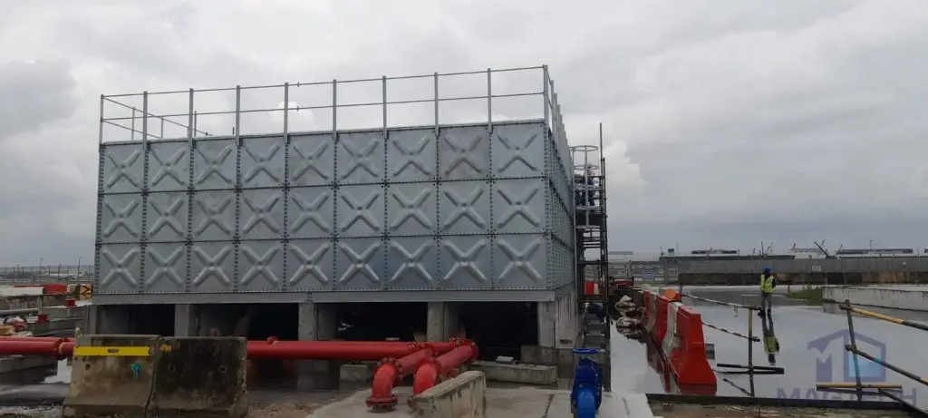 Hot-dipped galvanized pressed steel water tanks at ARC Changi T5, Singapore – completed HDG sectional tank connected to fire protection pipework