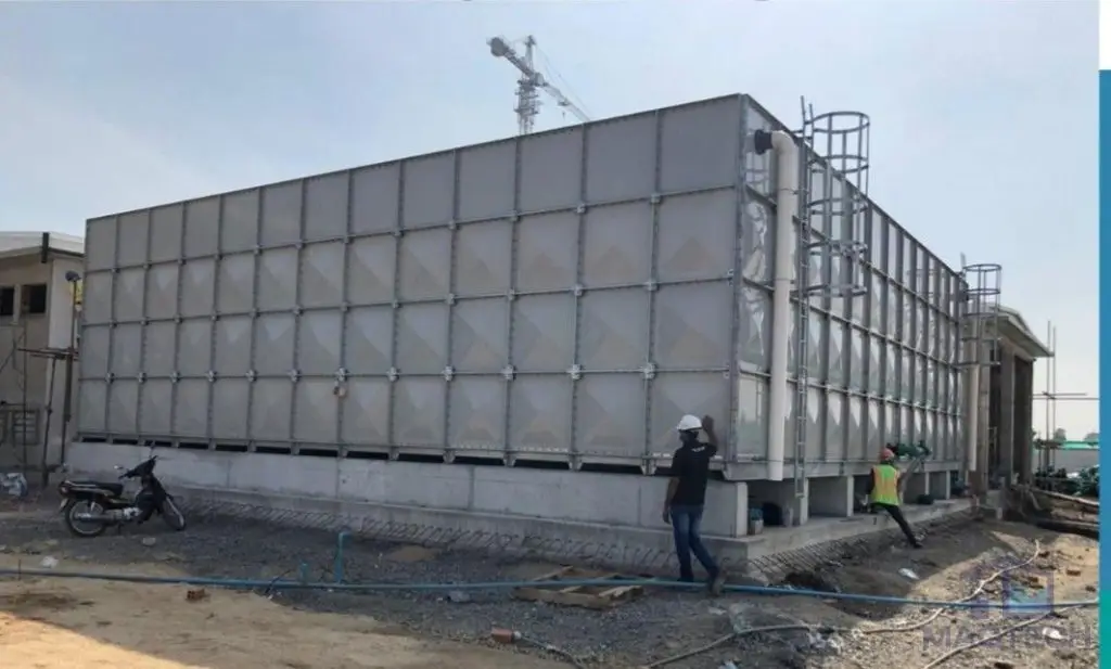 FRP/GRP water tank installation at OCIC Exhibition Centre, Cambodia – sectional tank during on-site construction