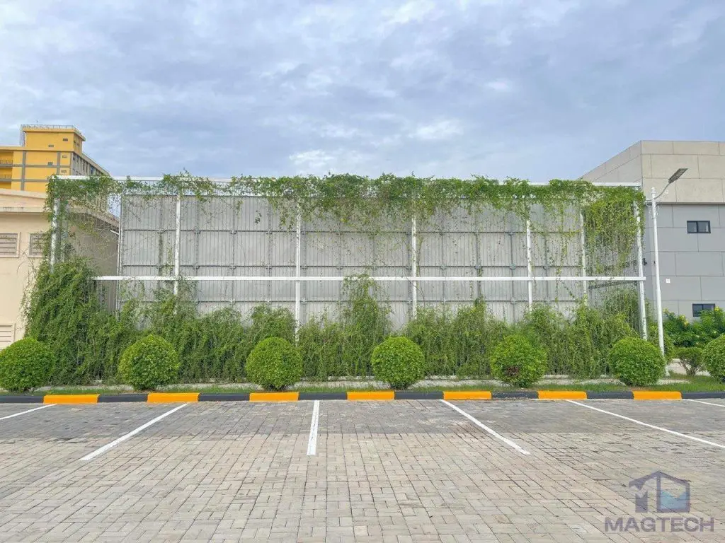 FRP/GRP water tank installation at OCIC Exhibition Centre, Cambodia – completed tank viewed from the car park