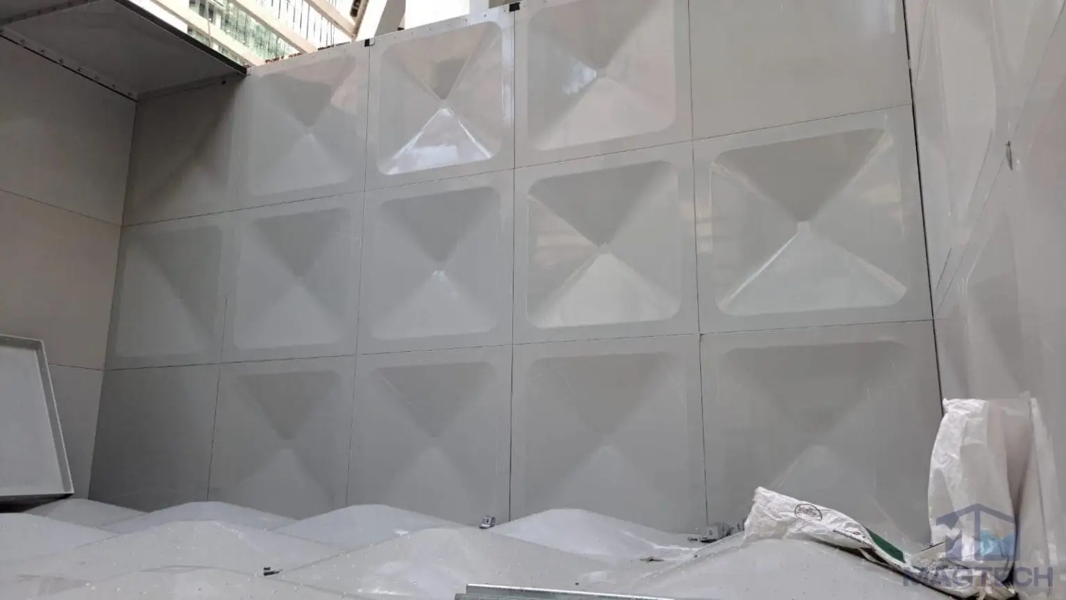 FRP/GRP domestic water tank replacement at One Finlayson Green, Singapore – completed sectional tank panels in the plant room