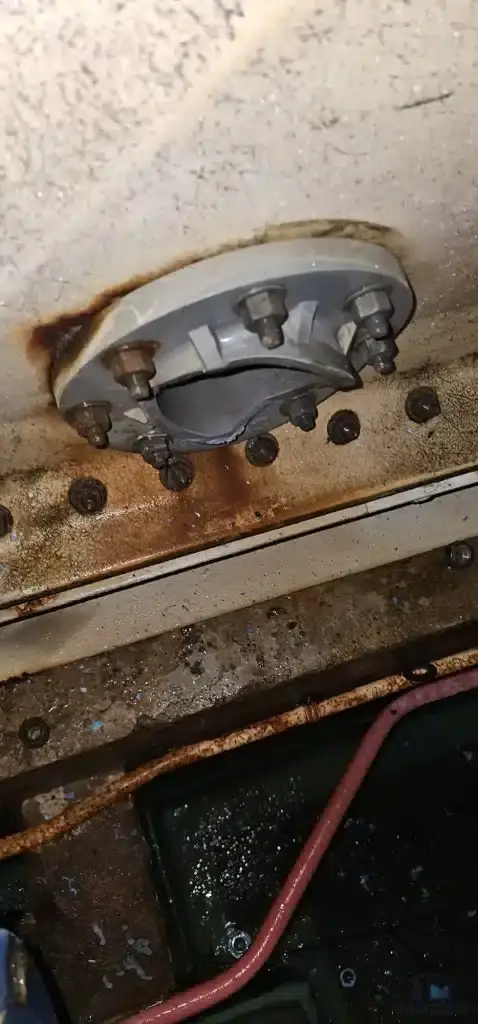 FRP water tank repair at Quartz Industrial Building, Singapore – broken and corroded flange connection before repair
