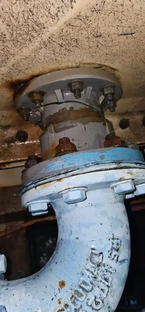 FRP water tank repair at Quartz Industrial Building, Singapore – corroded existing outlet pipe before repair