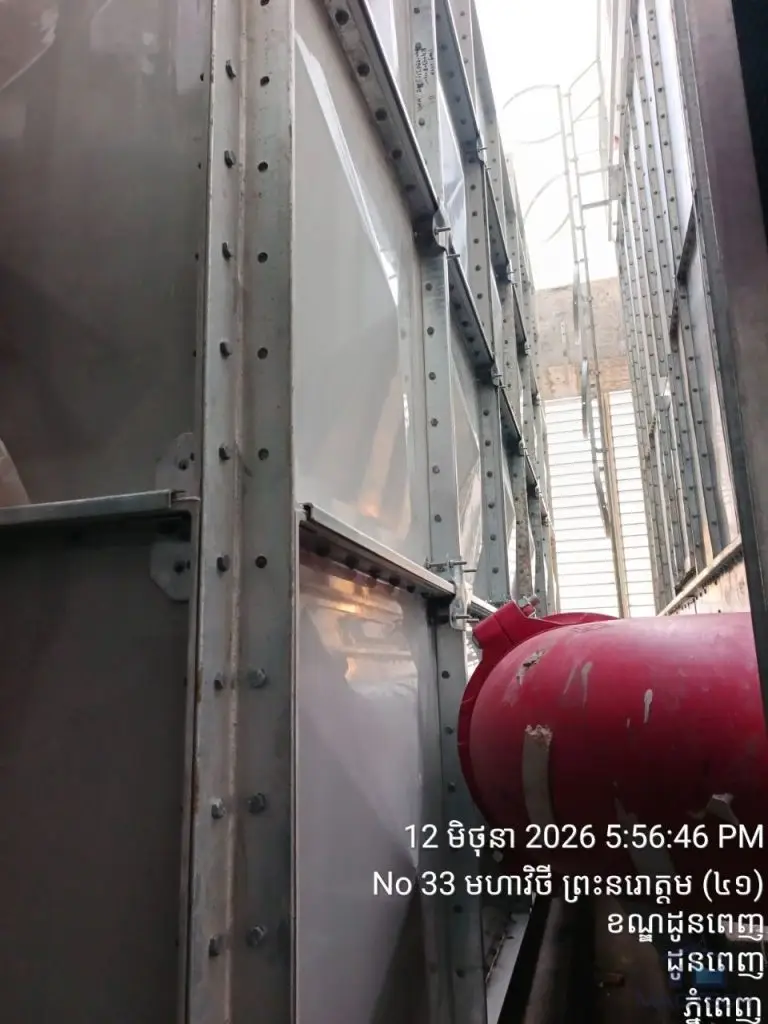 FRP/GRP water tank installation at Norodom Business Centre, Cambodia – narrow space between the tank and adjacent structure