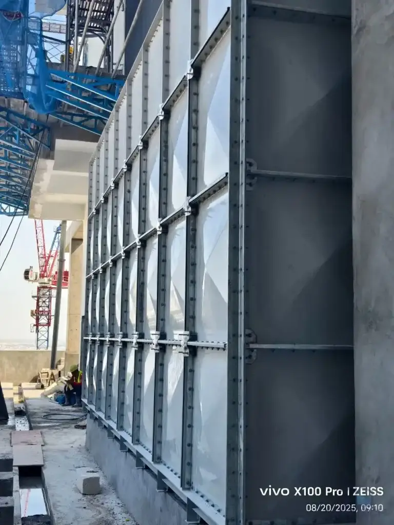 FRP/GRP water tank installation at Norodom Business Centre, Cambodia – exterior tank panels in the building service area