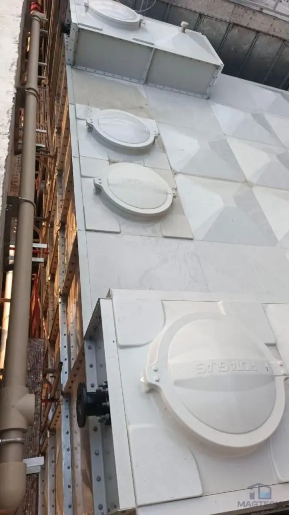 FRP/GRP water tank installation at Norodom Business Centre, Cambodia – top view of the tank roof panels and access hatches