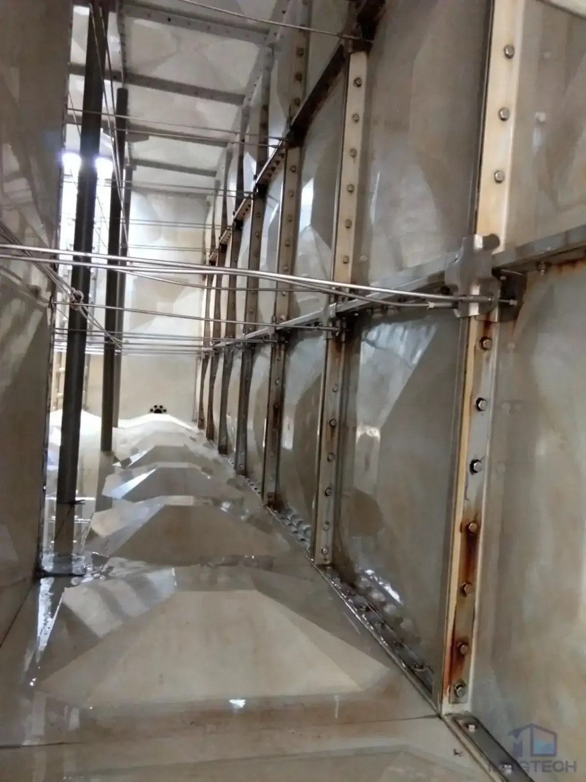 FRP sectional water tank repair at Southbank, Singapore – internal bracing and panels before rectification
