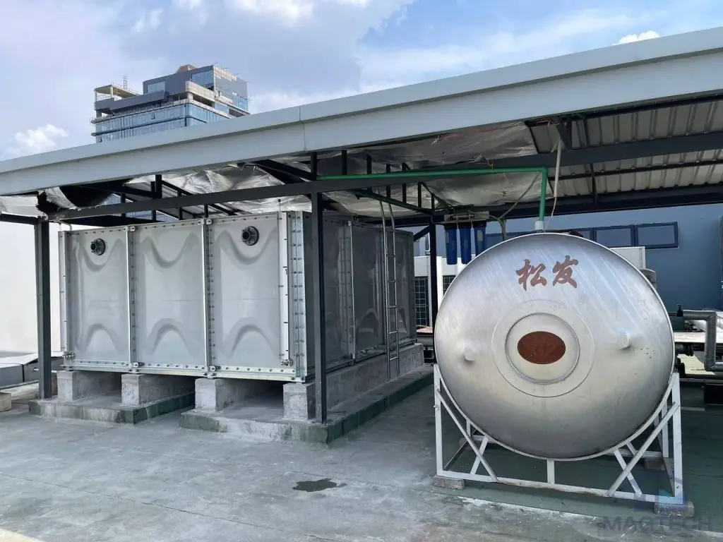 FRP sectional domestic water tank installation at Samaky Tower, Cambodia – completed tank beside the existing cylindrical tank