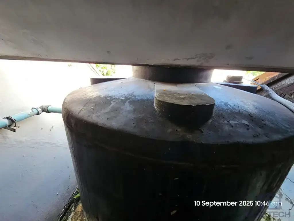 Old circular FRP water tank before replacement at 110C Sixth Avenue