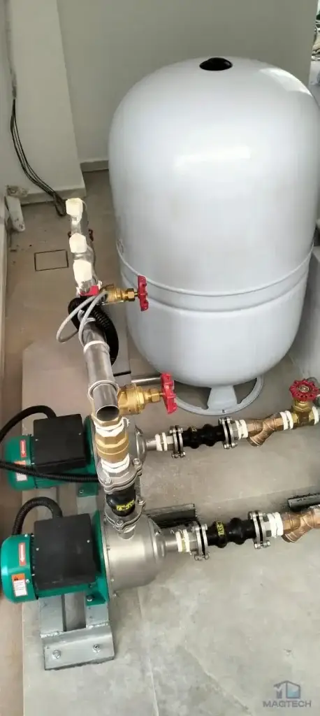 FRP domestic water tank and booster system installation at 92 Siglap Drive, Singapore – booster pumps, pressure vessel and connected pipework