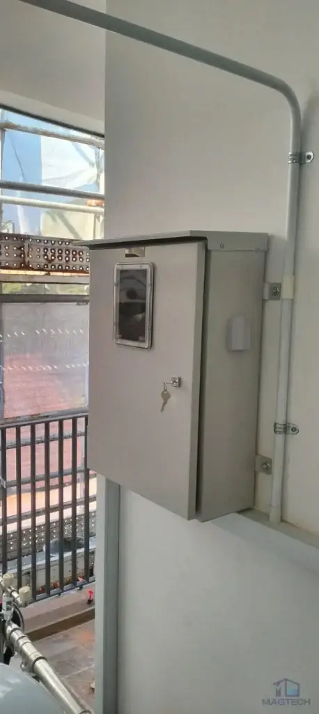 FRP domestic water tank and booster system installation at 92 Siglap Drive, Singapore – electrical control panel beside the completed tank