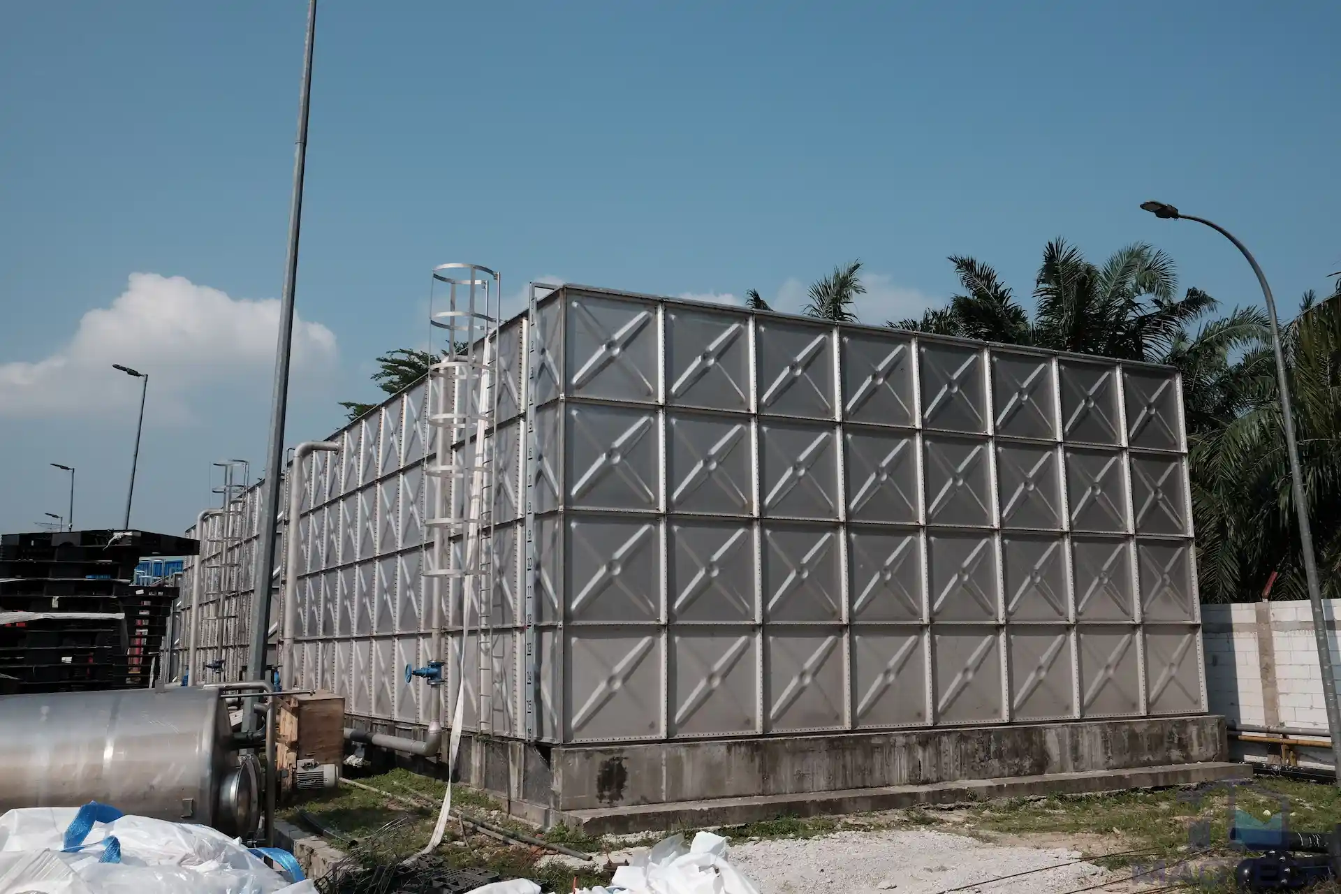 Stainless steel sectional water tank installed outdoors - How Long Do FRP and Stainless Steel Water Tanks Last Body