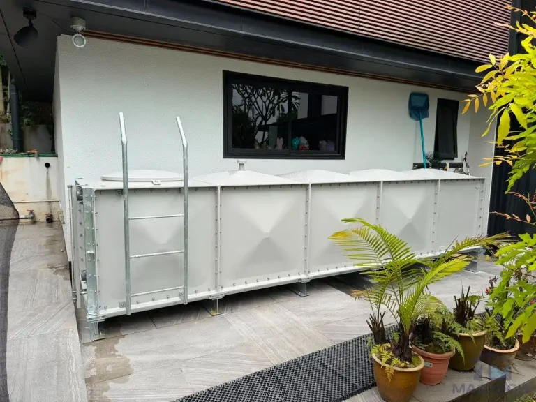 FRP rainwater tank installation at 36 Fifth Avenue Singapore - completed tank along the house