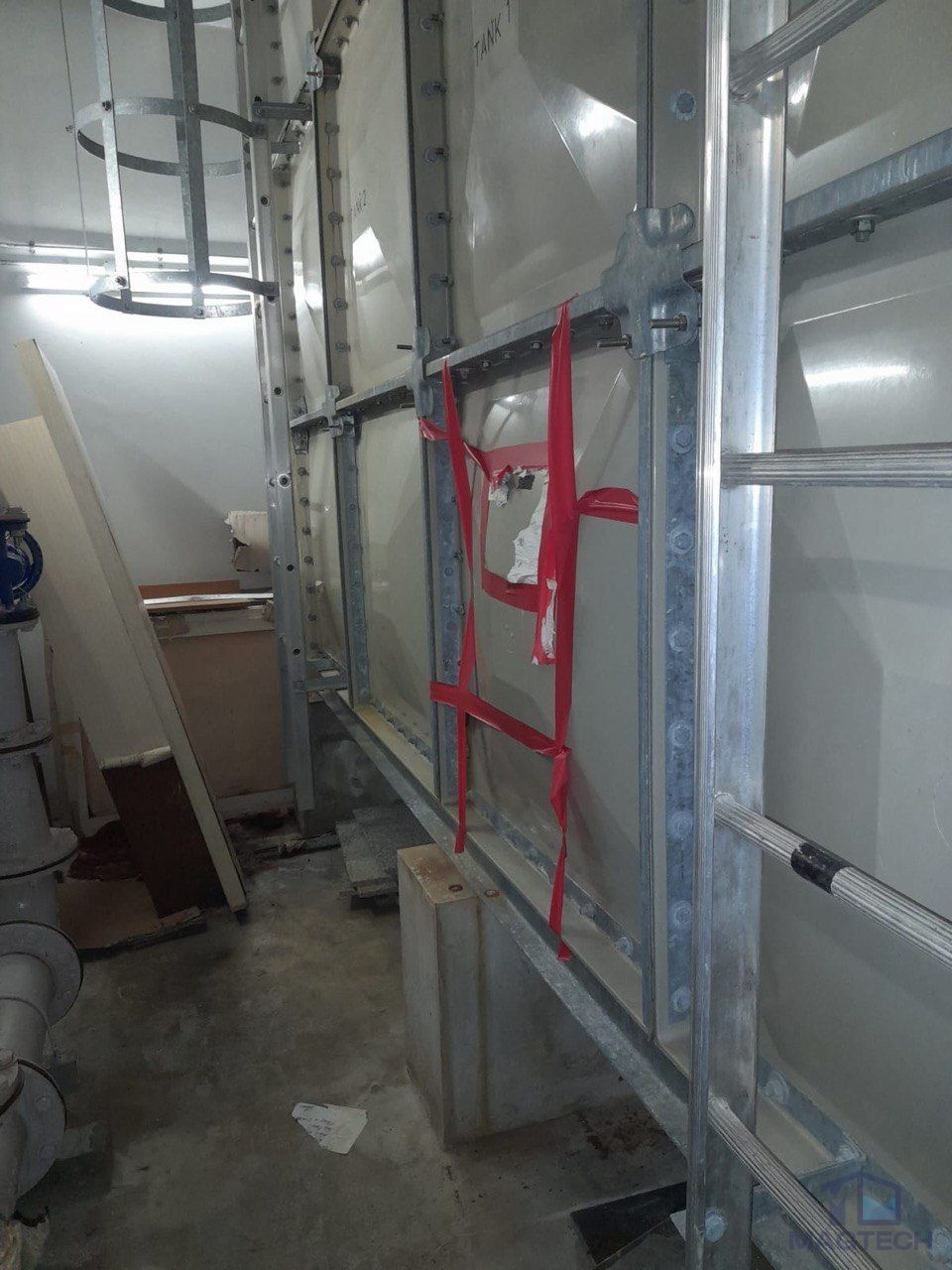 FRP water tank panel repair at 8 Novena Drive Singapore - cracked panel marked before removal