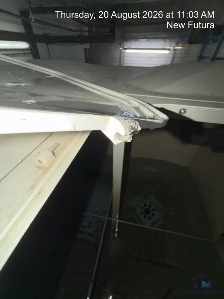 FRP water tank repair at New Futura Singapore - broken manhole cover before replacement