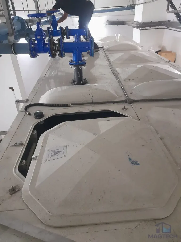 FRP water tank repair at New Futura Singapore - existing manhole cover of a discontinued model