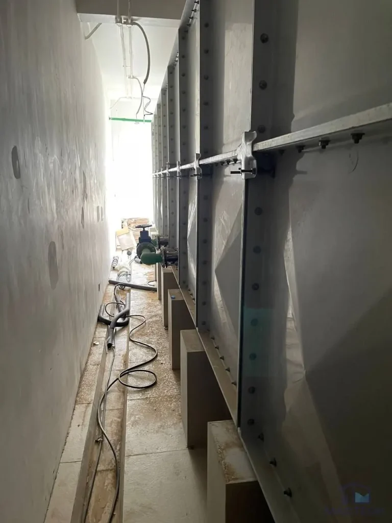 GRP water tank installation at Grand Villa Cambodia - completed tank run along the tank room